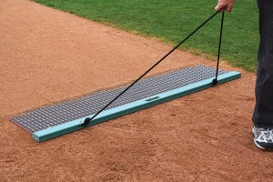 The leading edge works to level surfaces while securely holding the rigid steel mat at a slight angle.