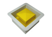 Tapered plug (yellow inner portion) and ground mount (white outer portion)