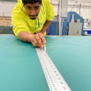 Person measuring fabric