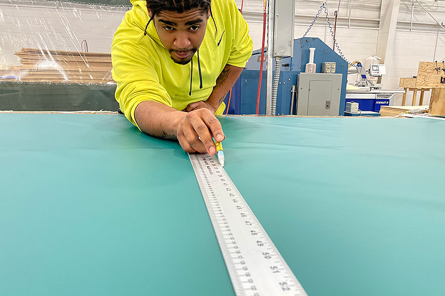 Person measuring fabric