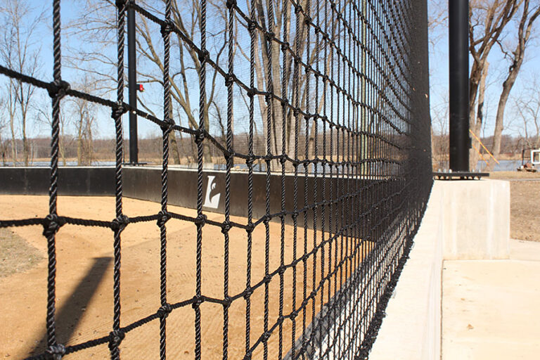 Looking through safety net at a ballfield